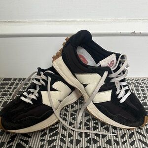 New Balance women’s Black and White Classic Trainer Sneakers